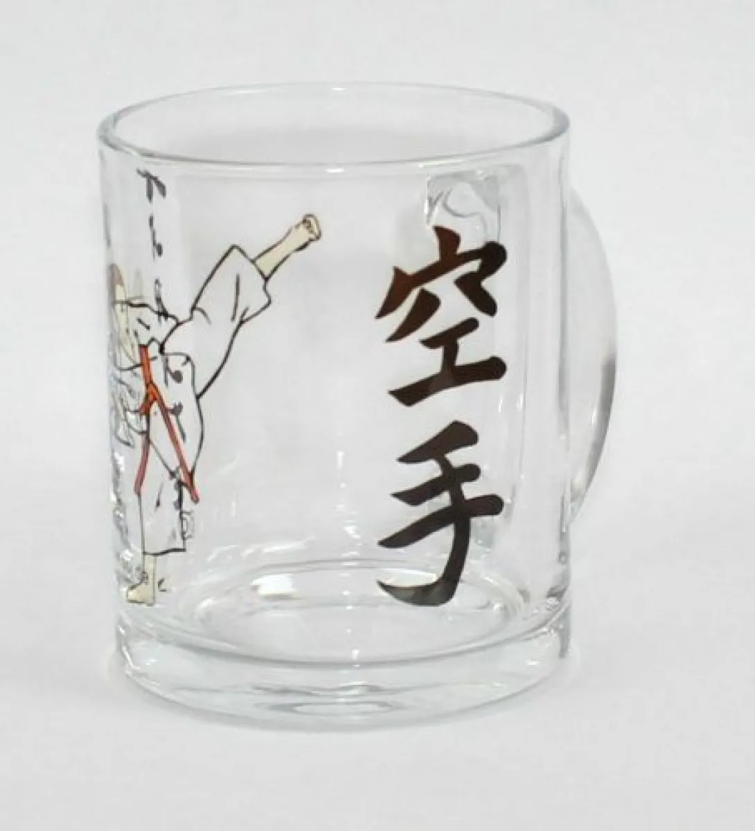 Glass mug with karate figure motif