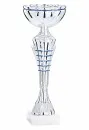Silver goblet with blue stripes on a white marble base